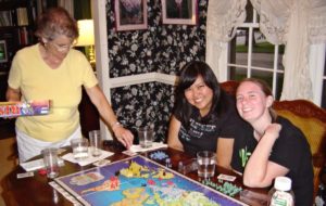 military girls playing Risk in home